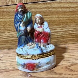 Nativity scene trinket box depicting the Holy Family (Mary, Joseph,baby Jesus).